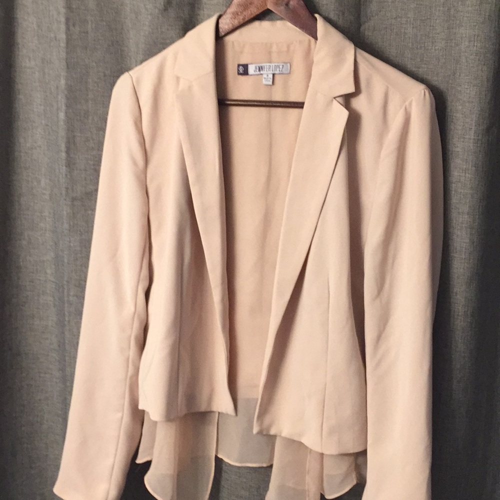 Jennifer Lopez blush pink blazer.